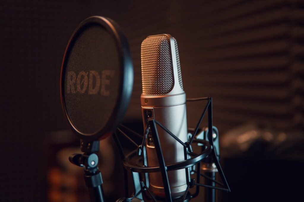 pexels-photo-3783471 Close-up of a studio microphone with pop filter, ideal for recording audio.